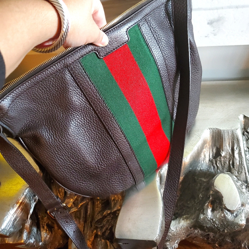 Authentic brown Gucci crossbody w/lady web design.